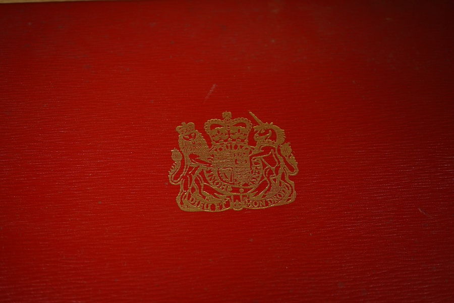 The Hon. Lord Justice Slade, ‘A Writ of Attendance at Parliament’, two vellum documents with ERII red seals in a red fitted case with a gold Royal Coat of Arms stamp, case 59cm wide x 23cm deep. Condition - some foxing